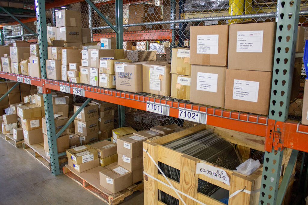 Additional stock is stored on racks outside the stock room