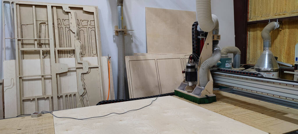 The CNC router cutting playfields and cabinet parts