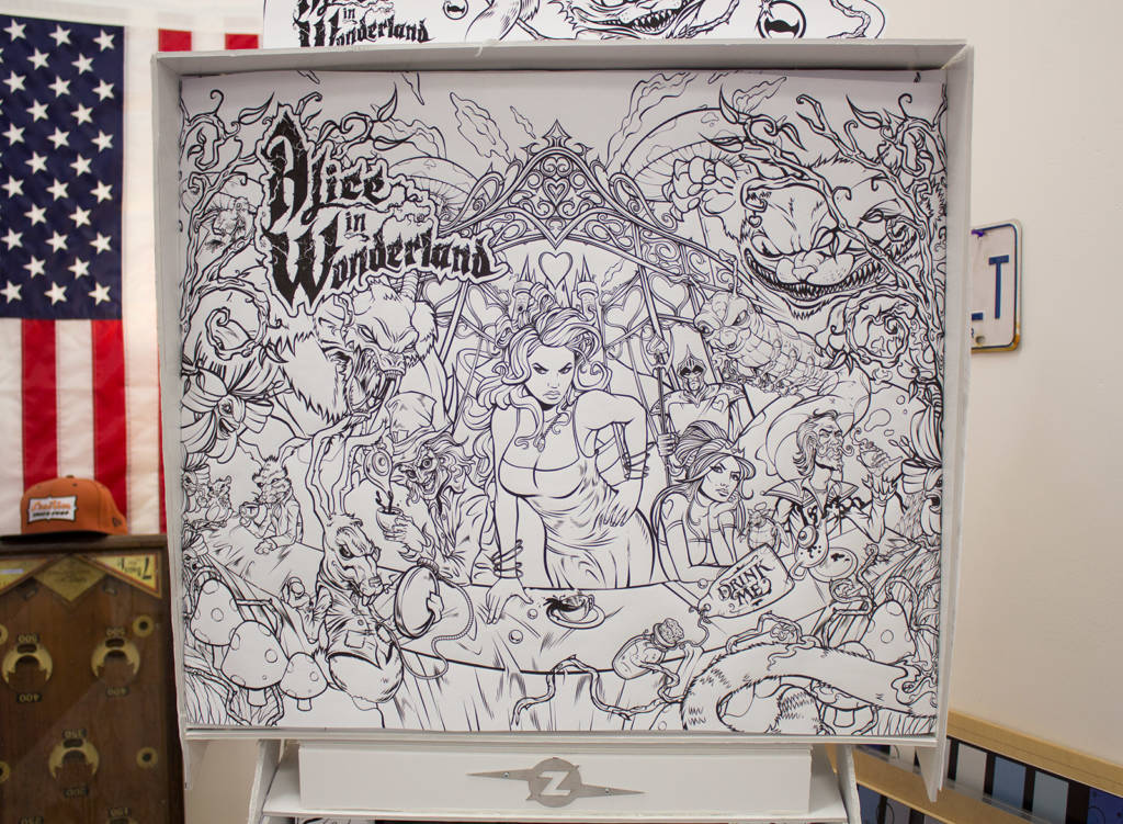 The outline backbox artwork for Alice in Wonderland