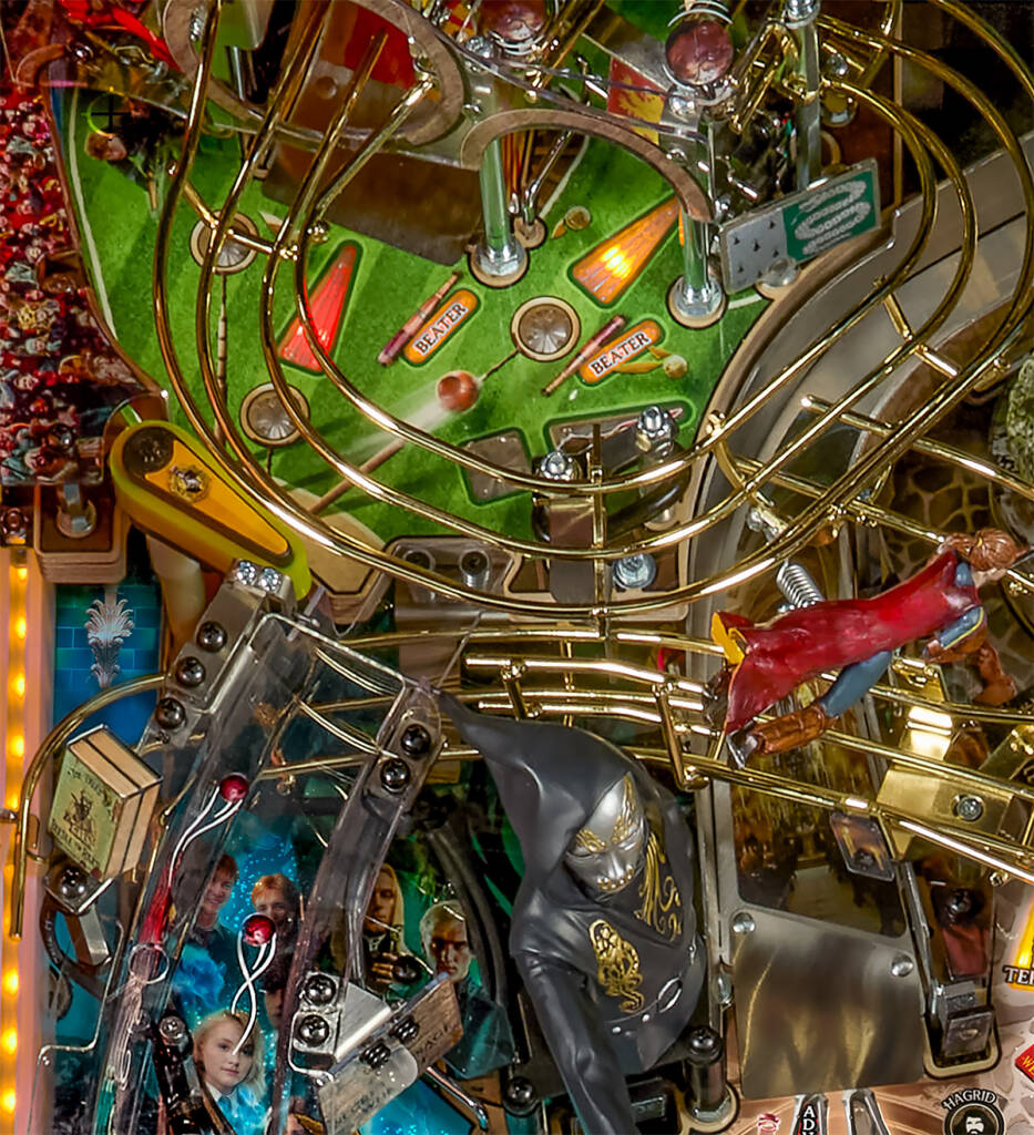 The upper-left corner features an upper playfield with a mini-flipper
